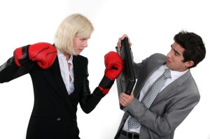 Businesspeople boxing.