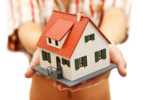 Model house in woman's hand