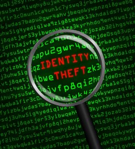 stockfresh_3962479_identity-theft-revealed-in-computer-code-through-a-magnifying-gl_sizeS-273x300
